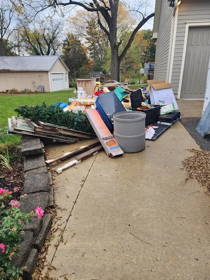 Dumpster being loaded with debris for Residential Dumpster Rental in Boonville